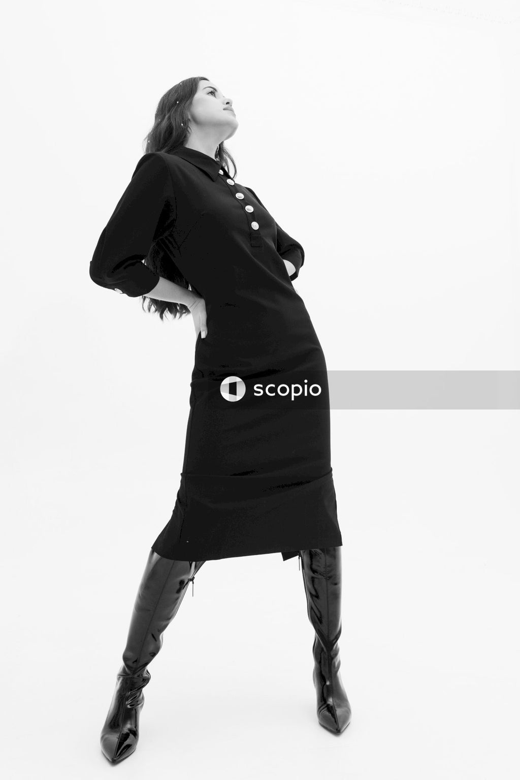 Woman in black long sleeve shirt and black pants