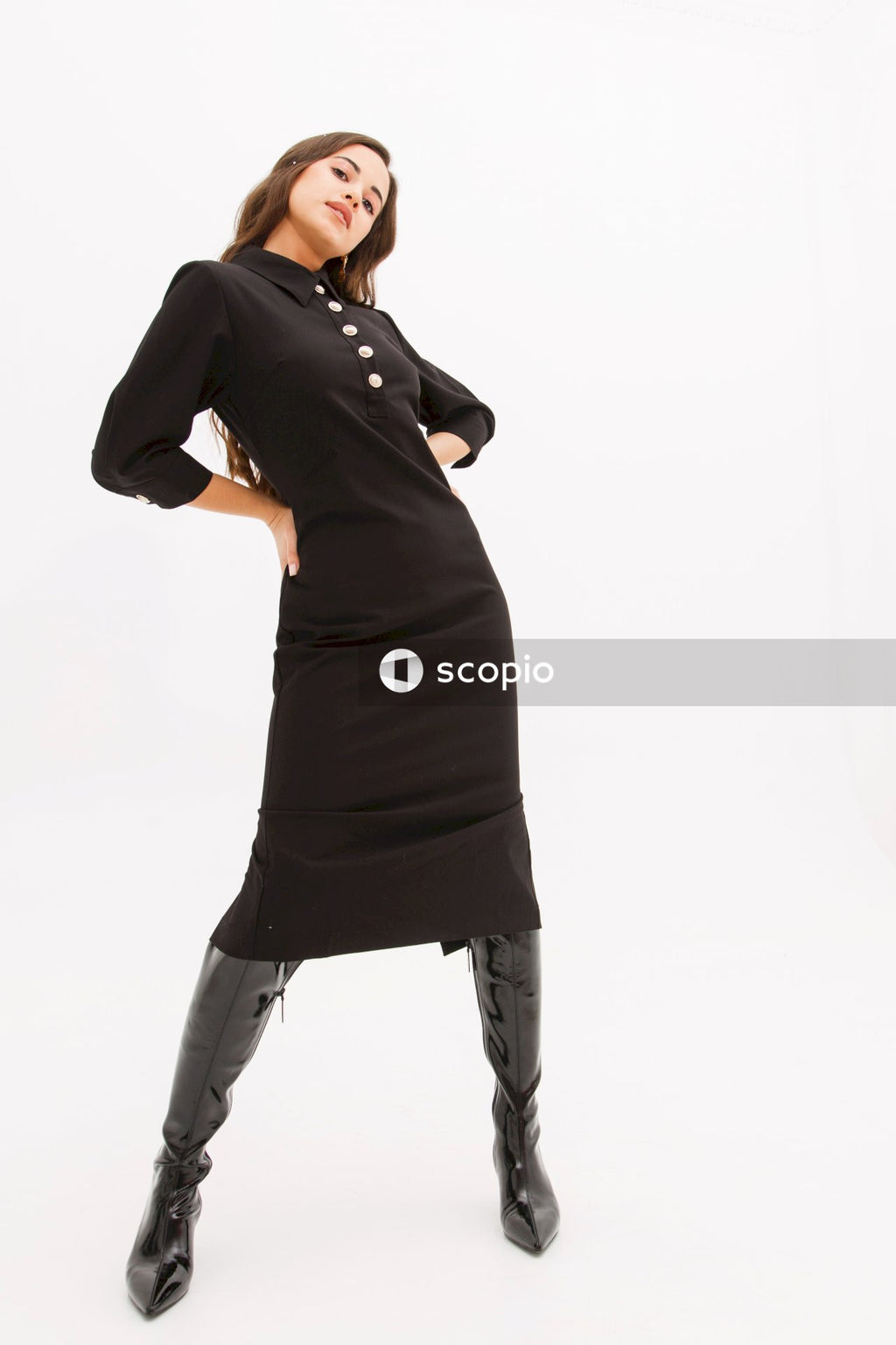 Woman in black long sleeve shirt and white pants