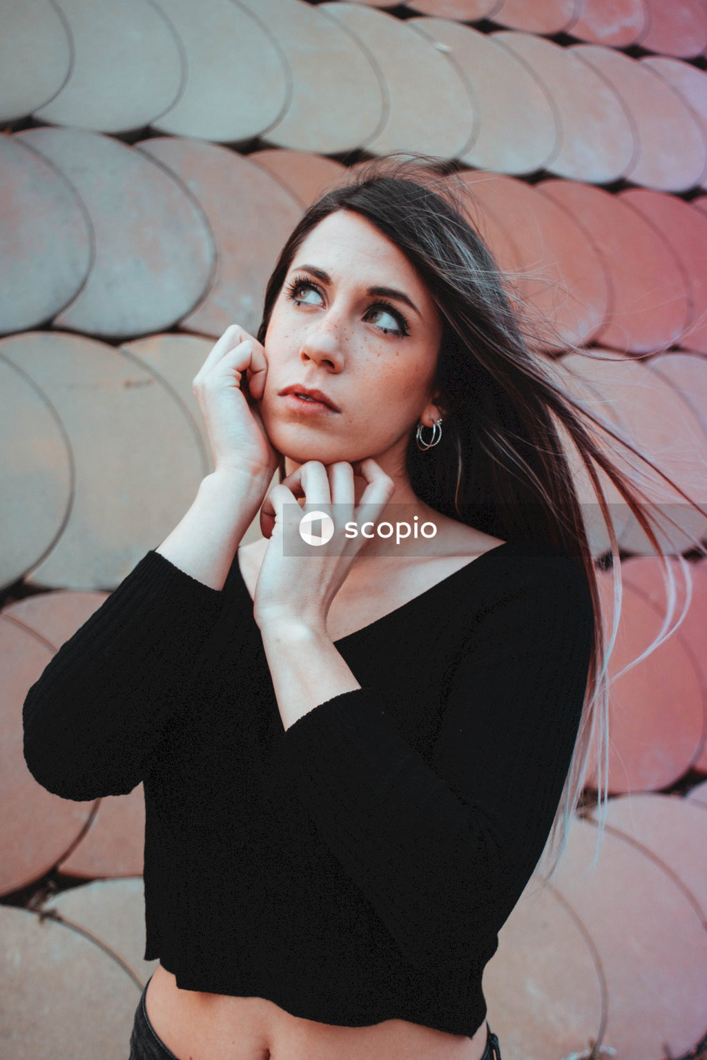 Woman in black long sleeve shirt standing outdoor