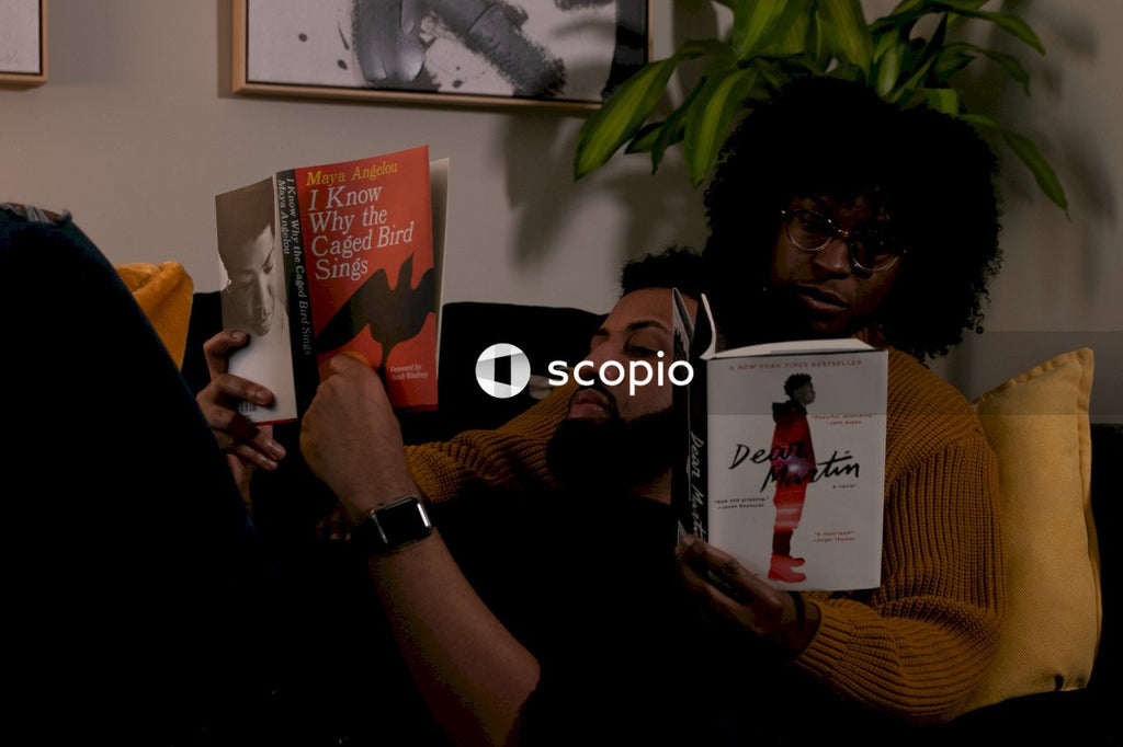 Couple sitting on couch reading books