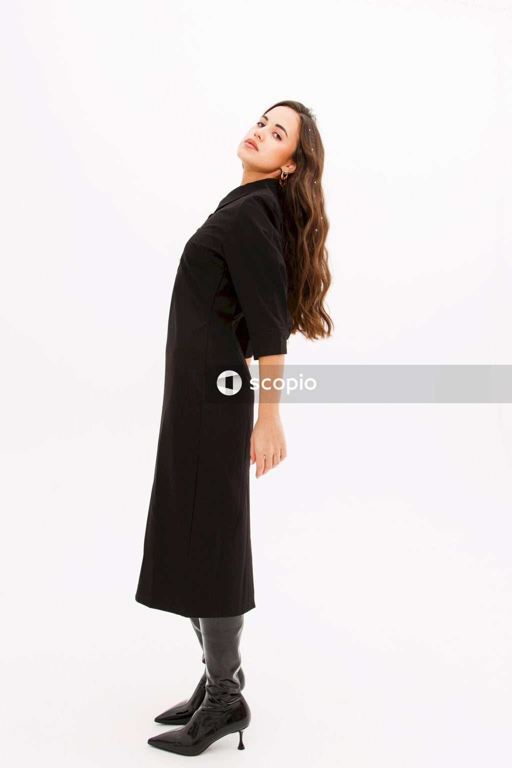 Woman in black short sleeve dress