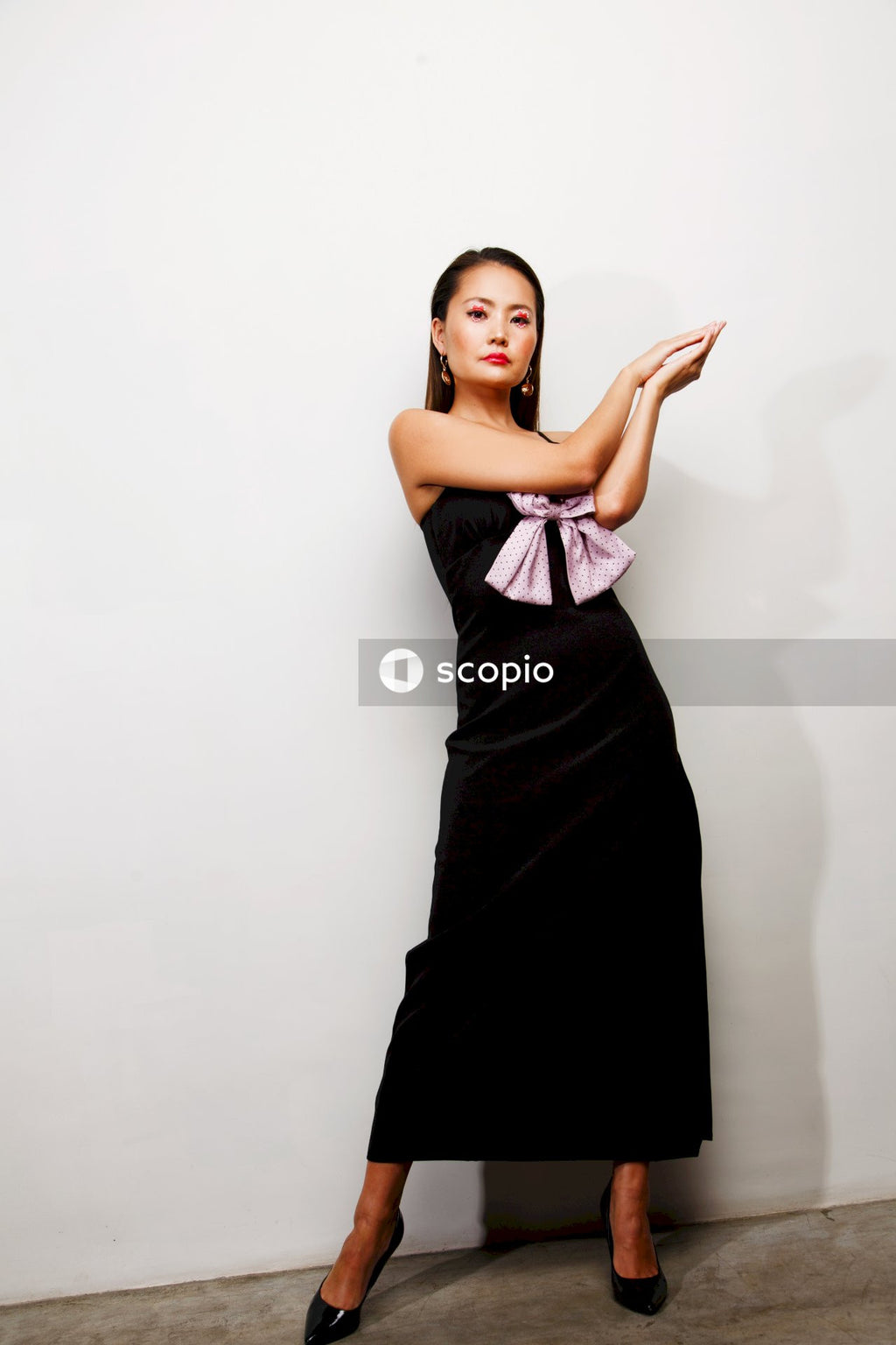 Woman in black sleeveless dress