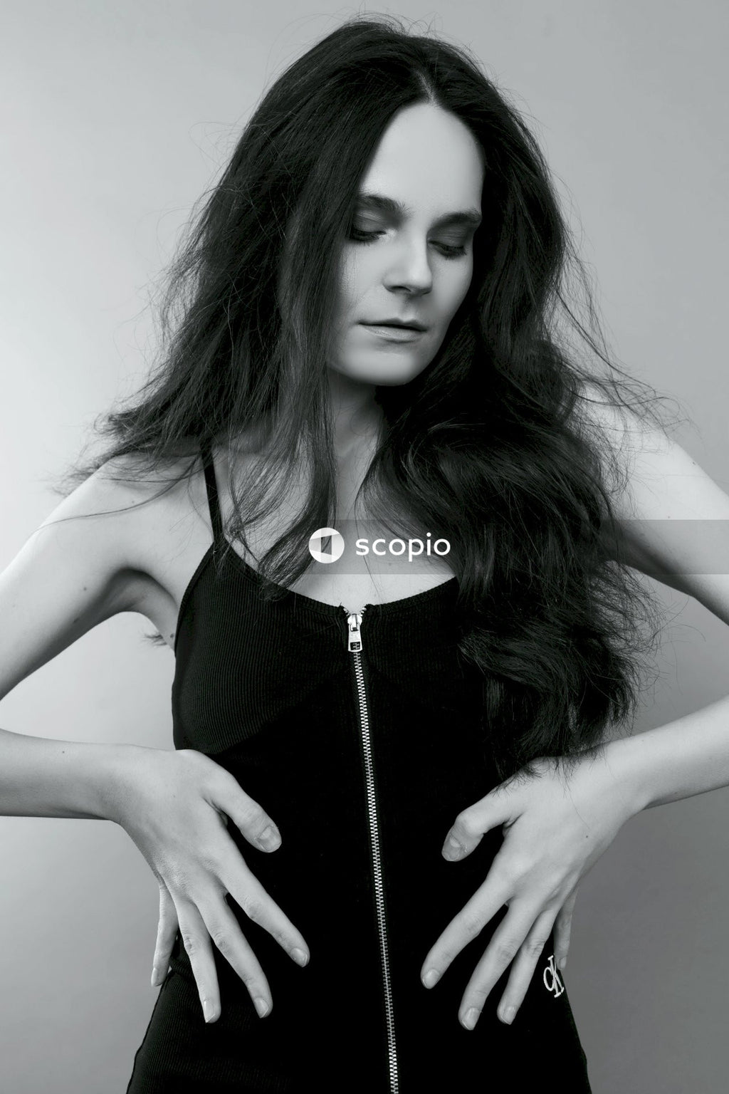 Woman in black spaghetti strap top