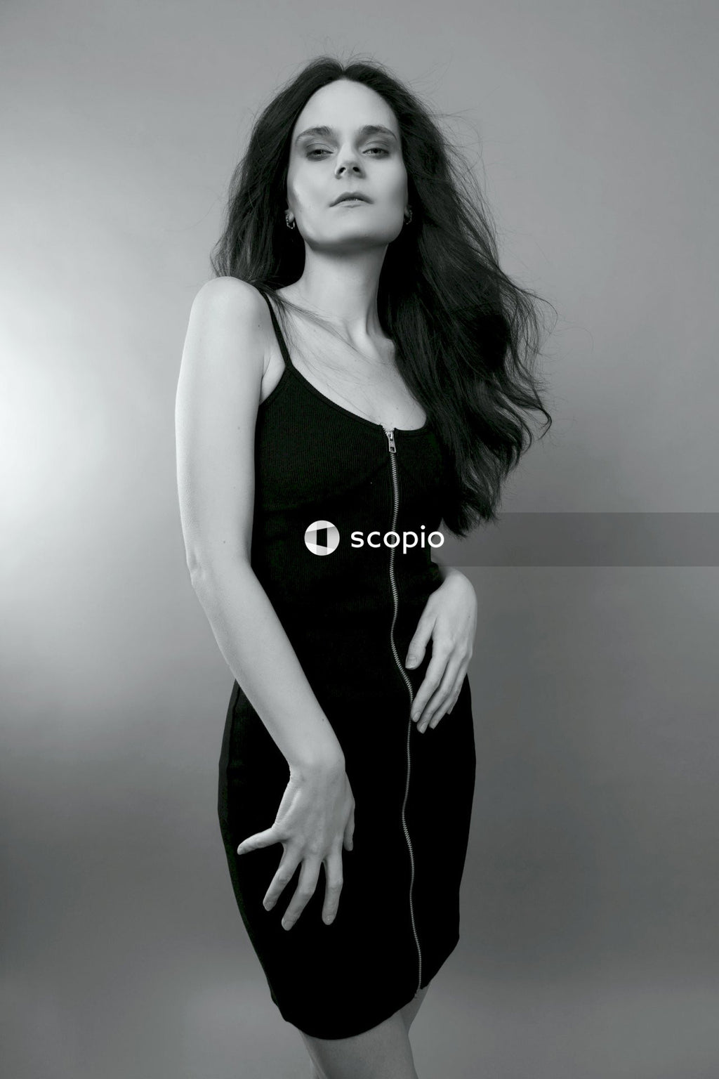 Woman in black spaghetti strap top