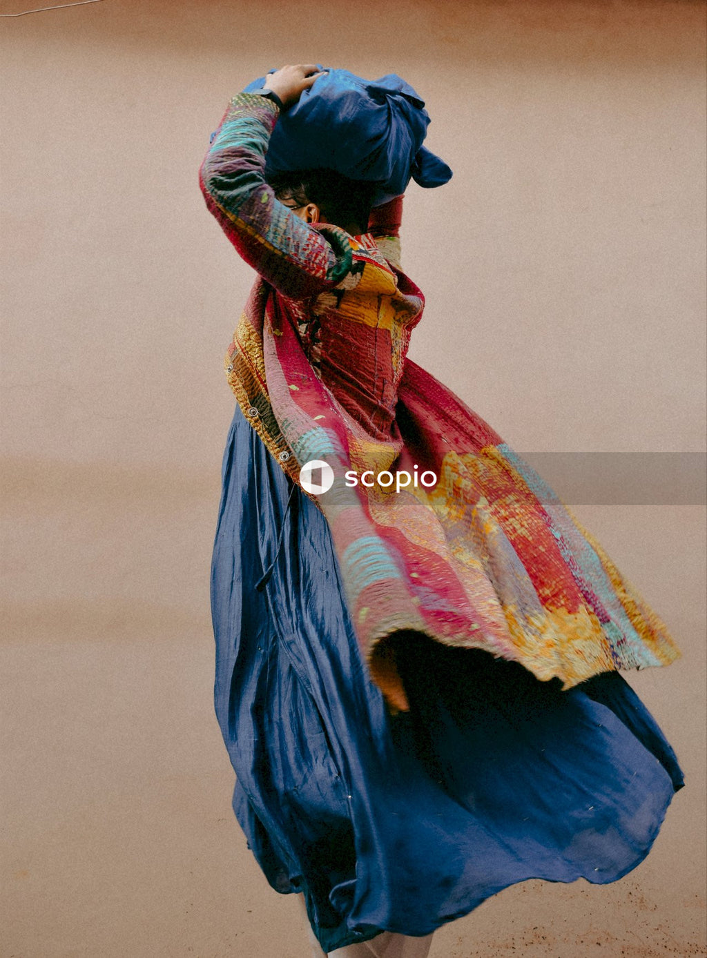 Woman in blue and yellow scarf