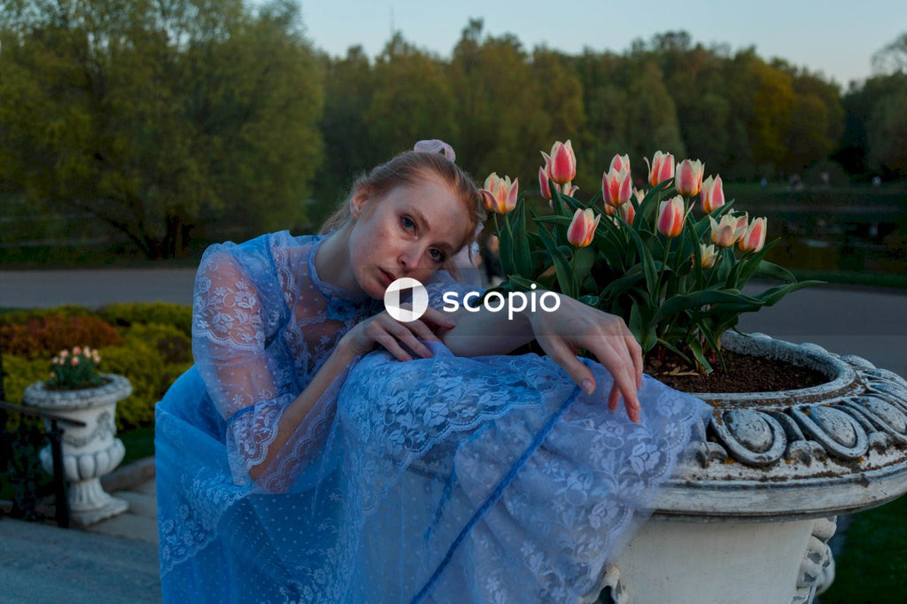 Woman in blue dress hugging girl in blue dress
