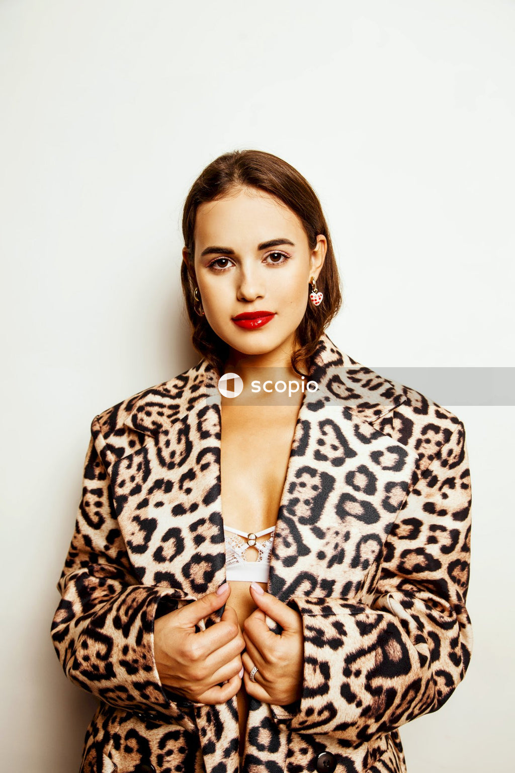 Woman in brown and black leopard print blazer