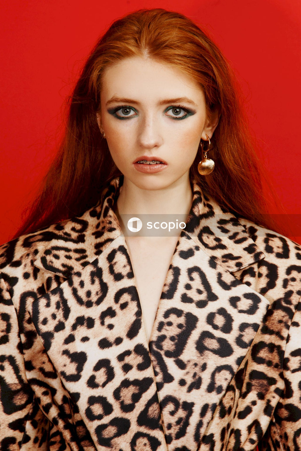 Woman in brown and black leopard print robe