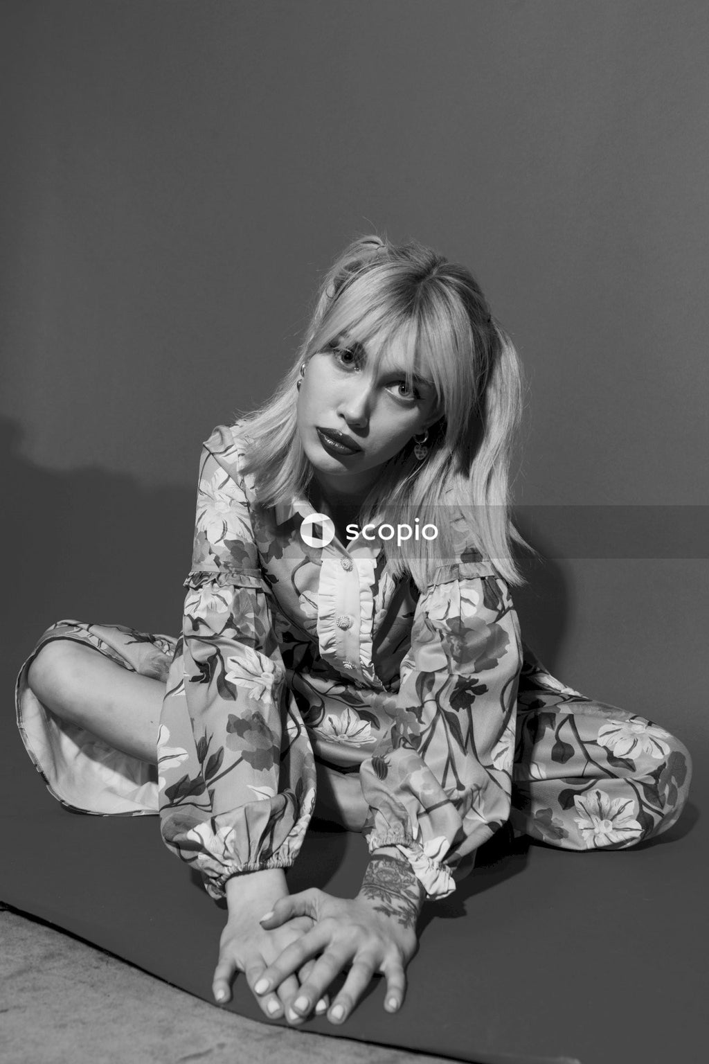 Woman in floral dress shirt
