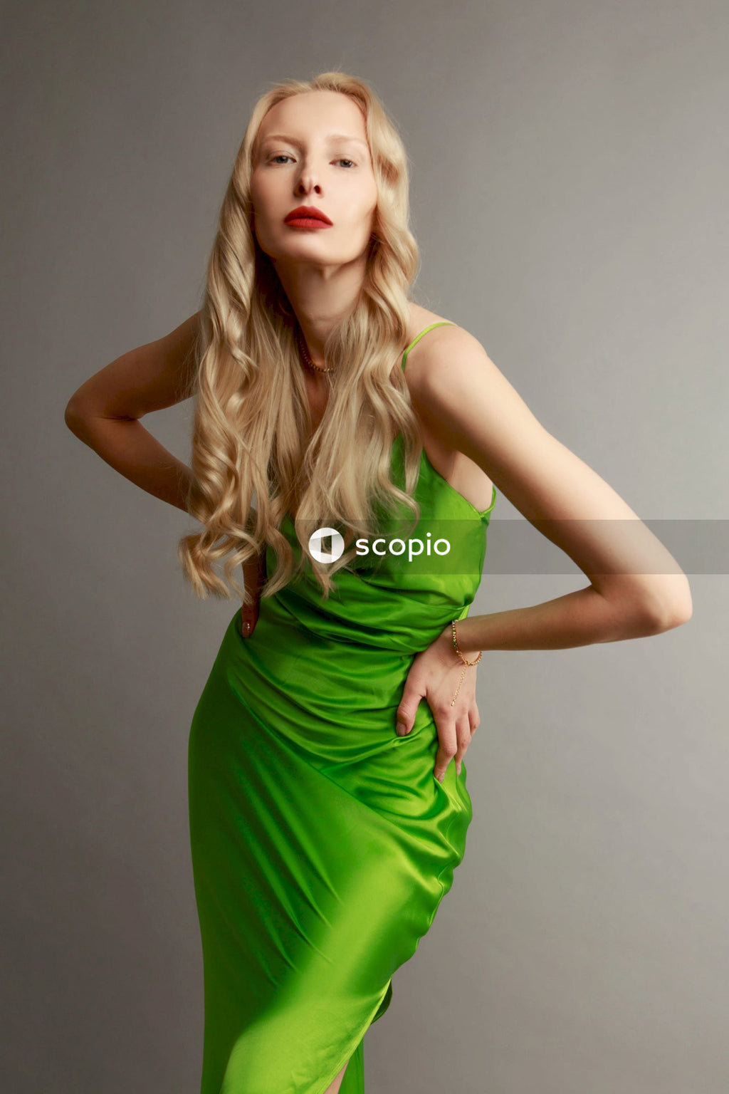 Woman in green sleeveless dress