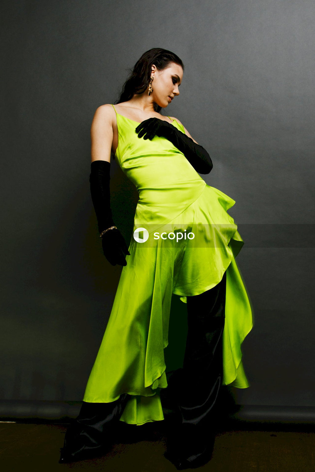 Woman in green sleeveless dress