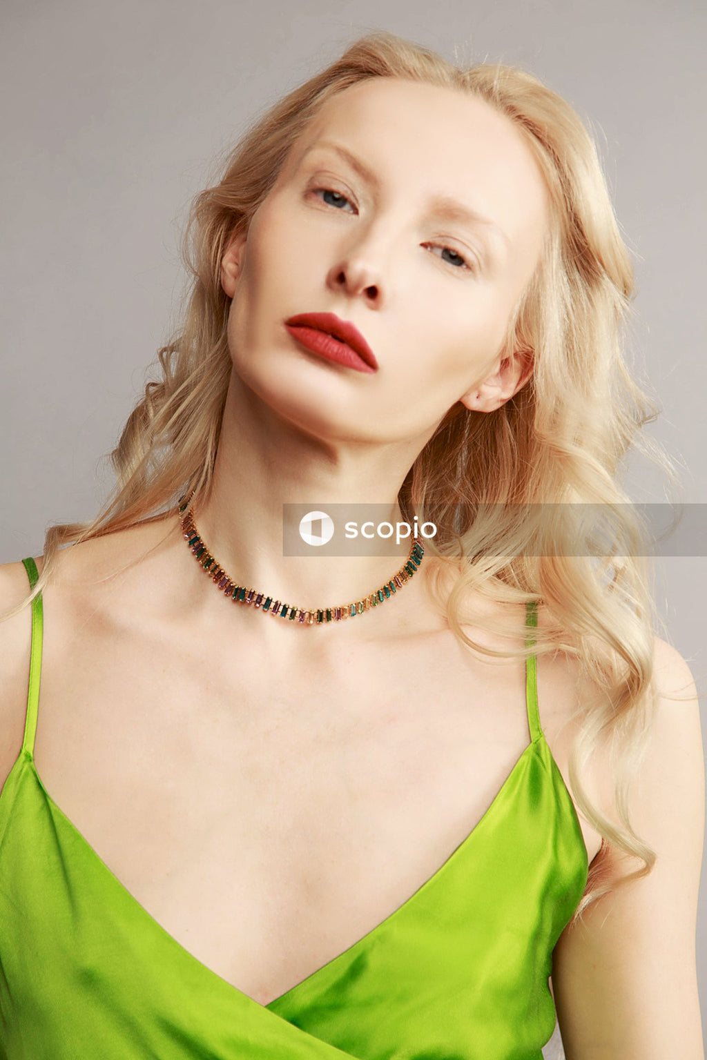 Woman in green spaghetti strap top