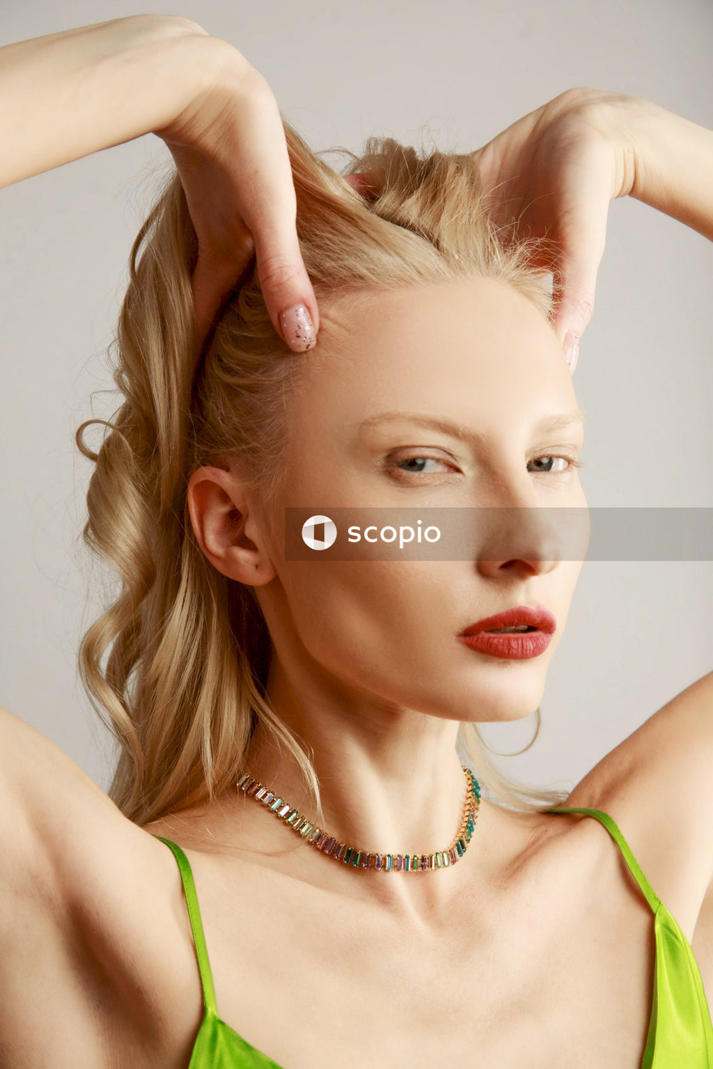 Woman in green spaghetti strap top