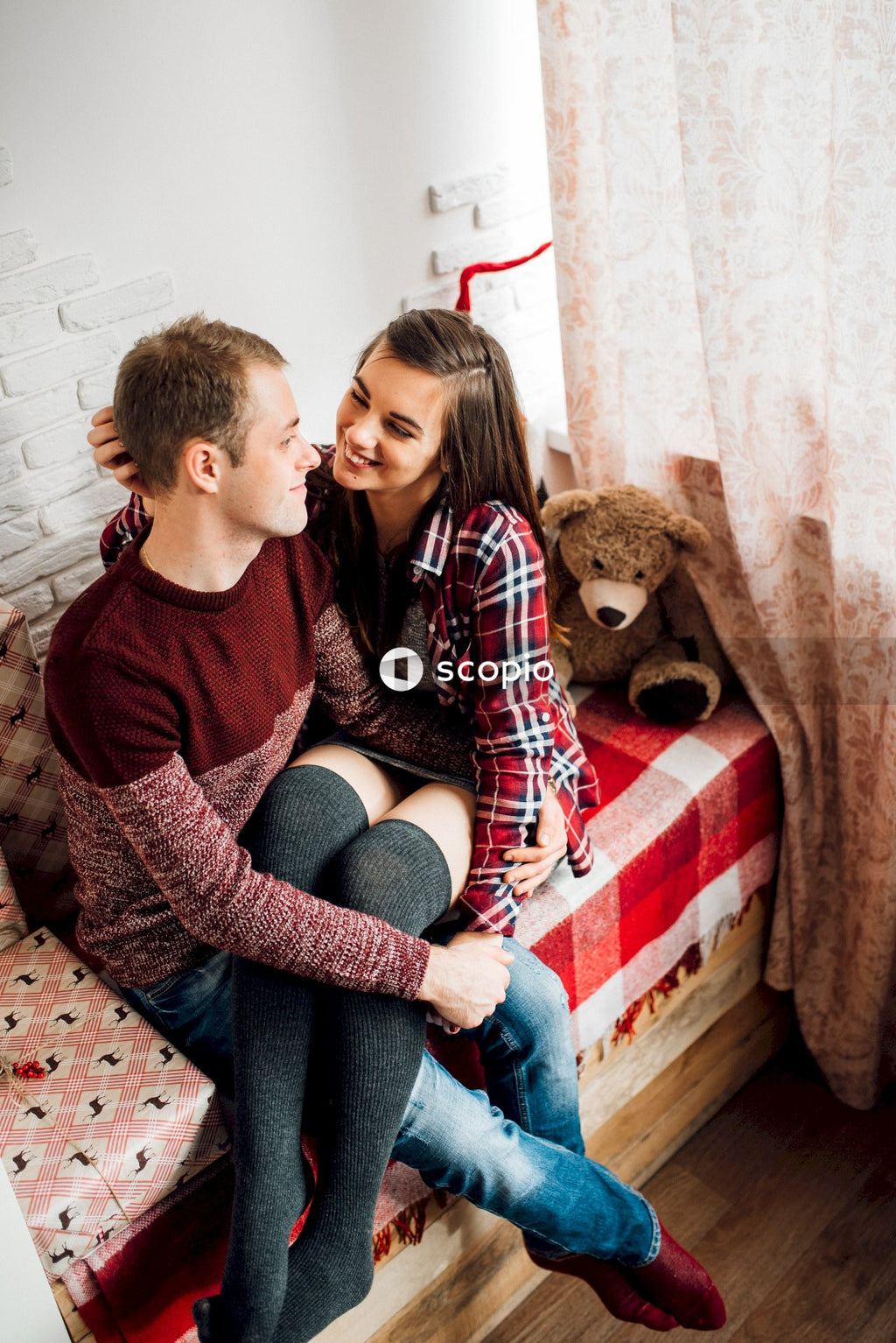 Woman and man hugging at home