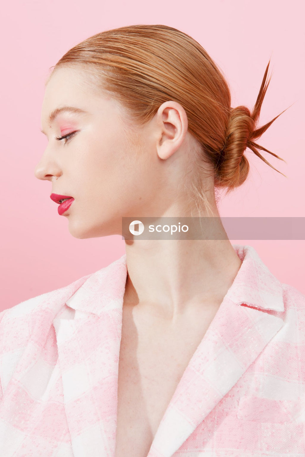 Woman in pink and white collared shirt