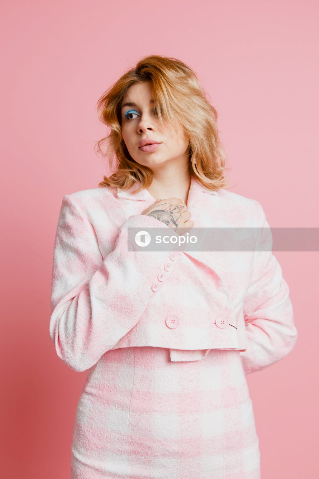 Woman in pink button up long sleeve shirt