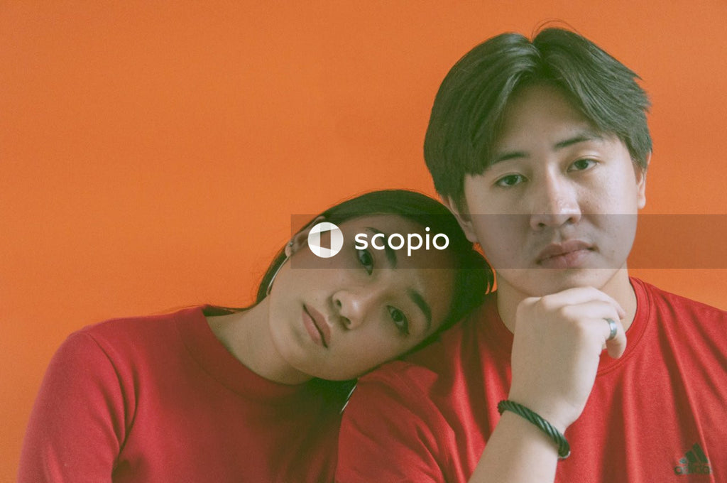 Man and woman in red shirts  against red background