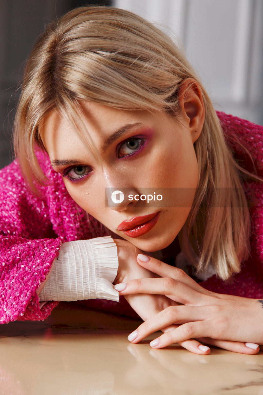 Woman in pink knit sweater