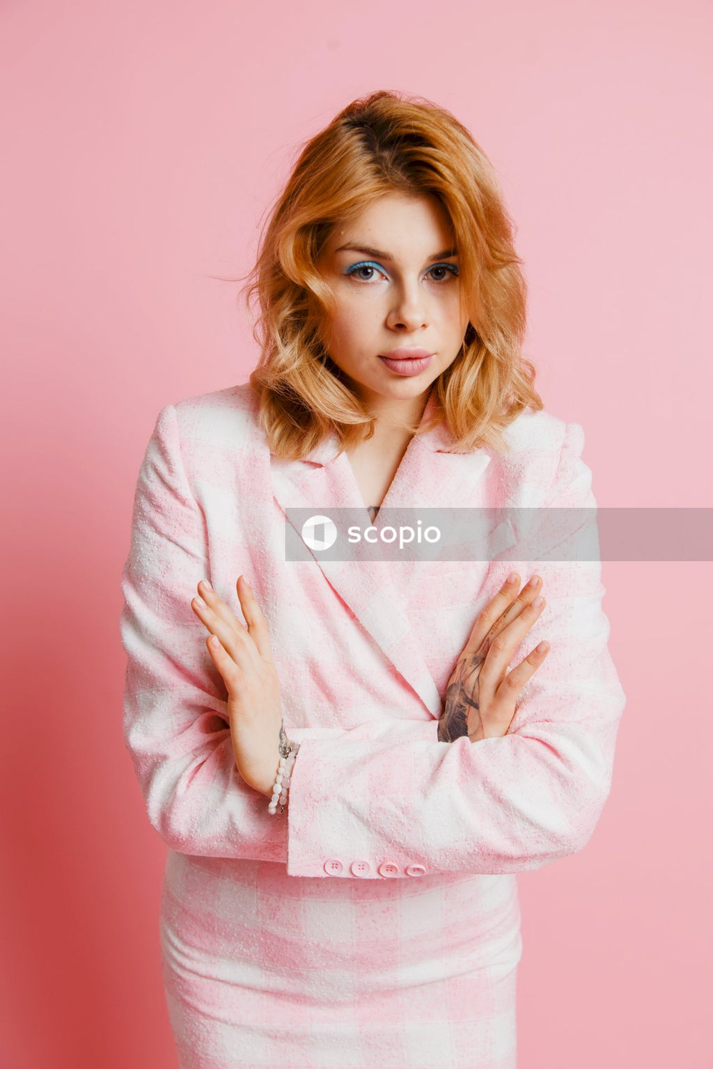 Woman in pink robe posing for photo