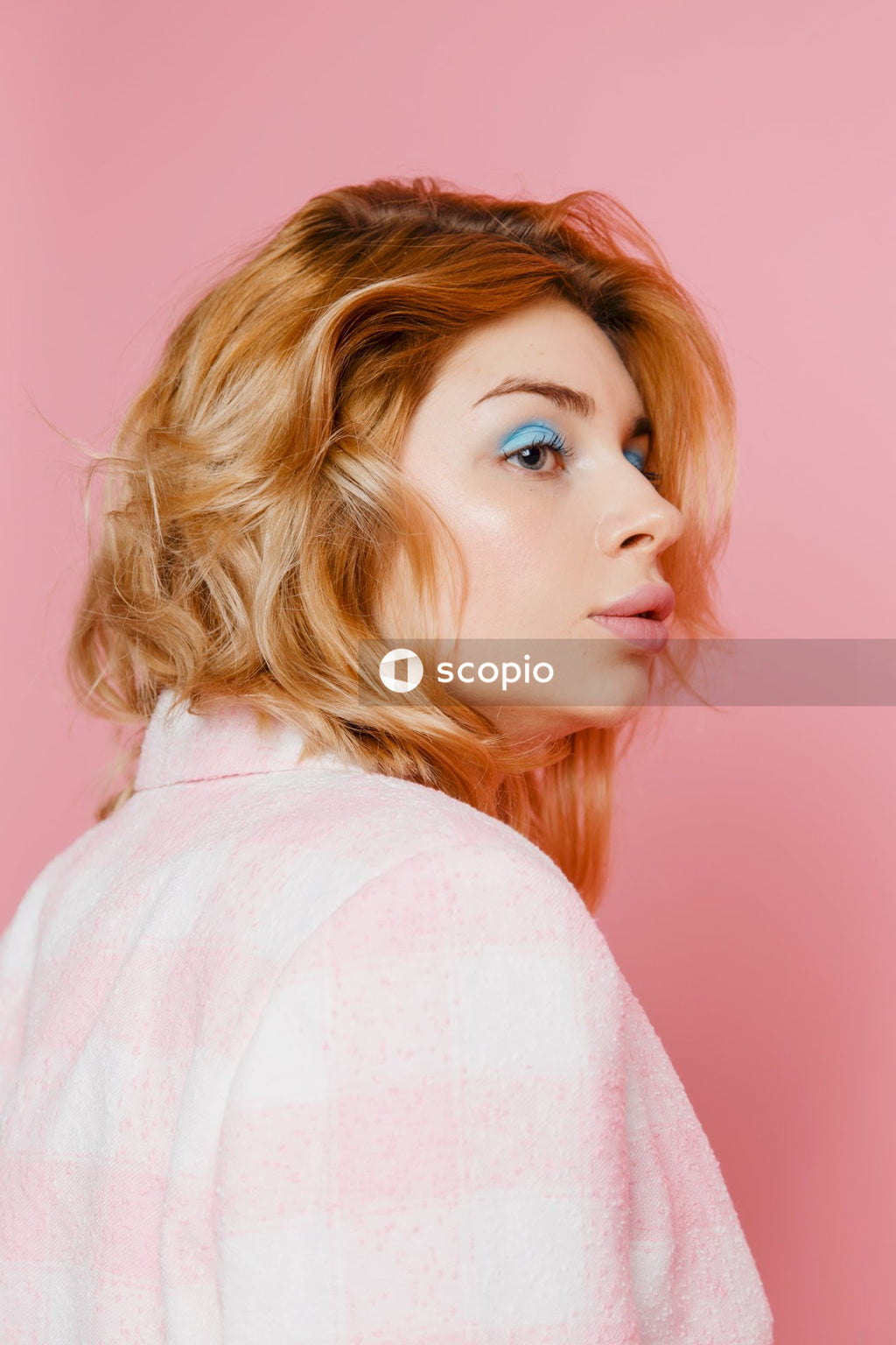 Woman in pink shirt with blonde hair