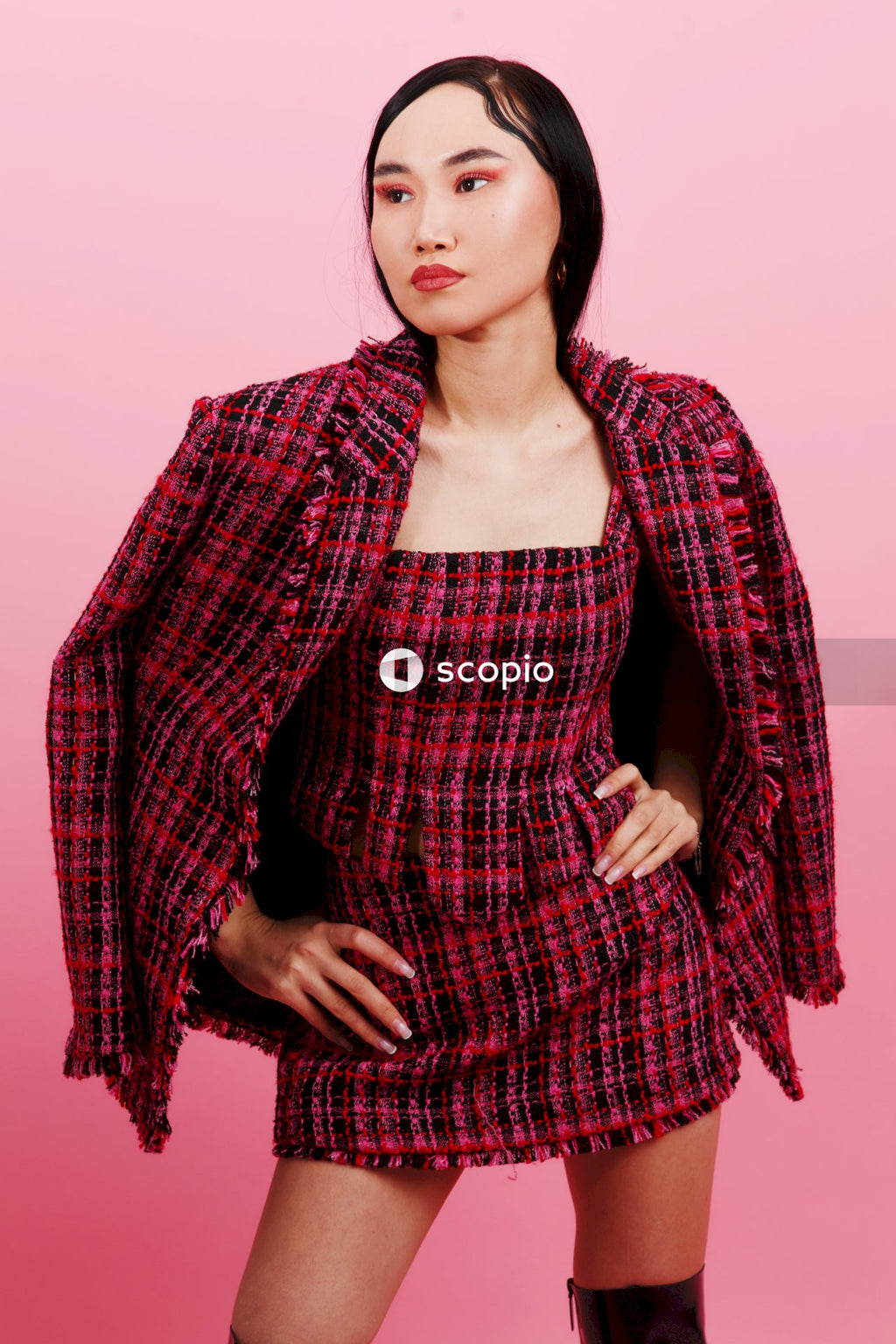 Woman in red and black plaid blazer