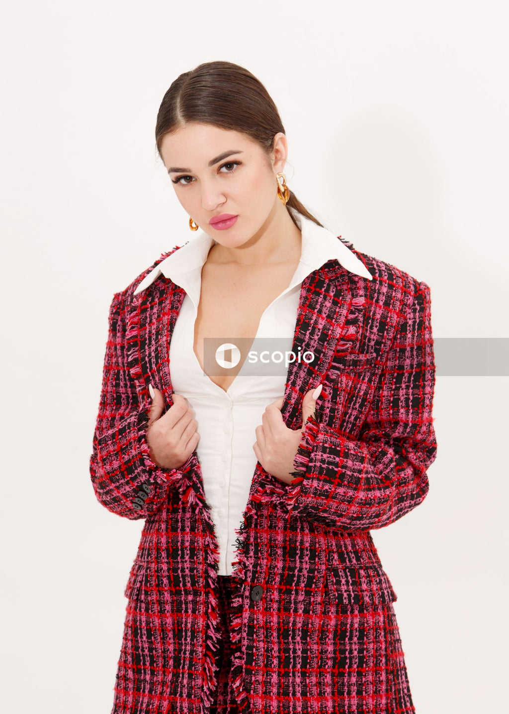 Woman in red and black plaid button up long sleeve shirt
