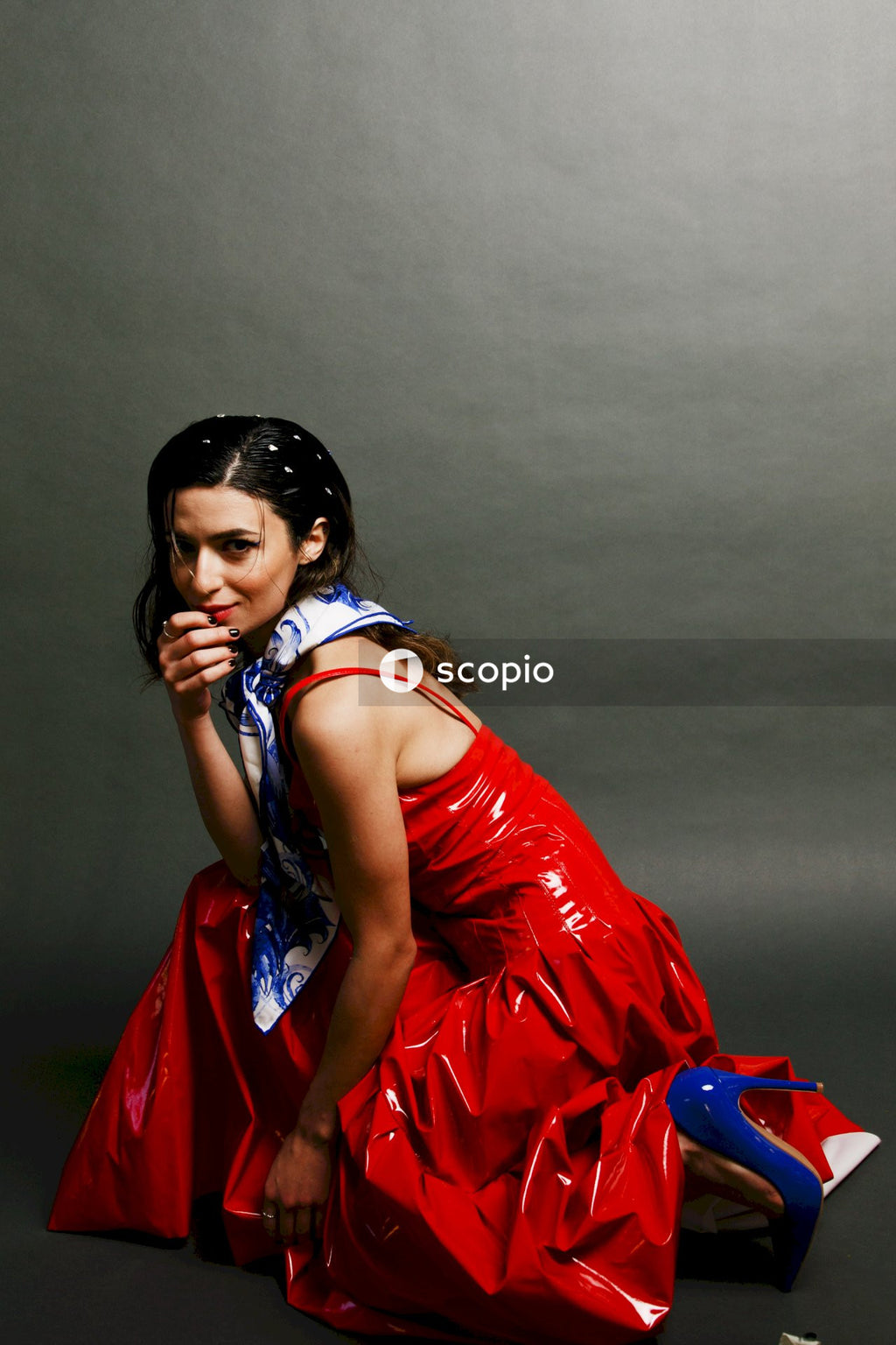 Woman in red and blue sleeveless dress