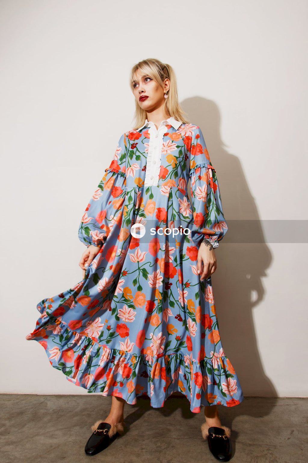 Woman in red and white floral dress