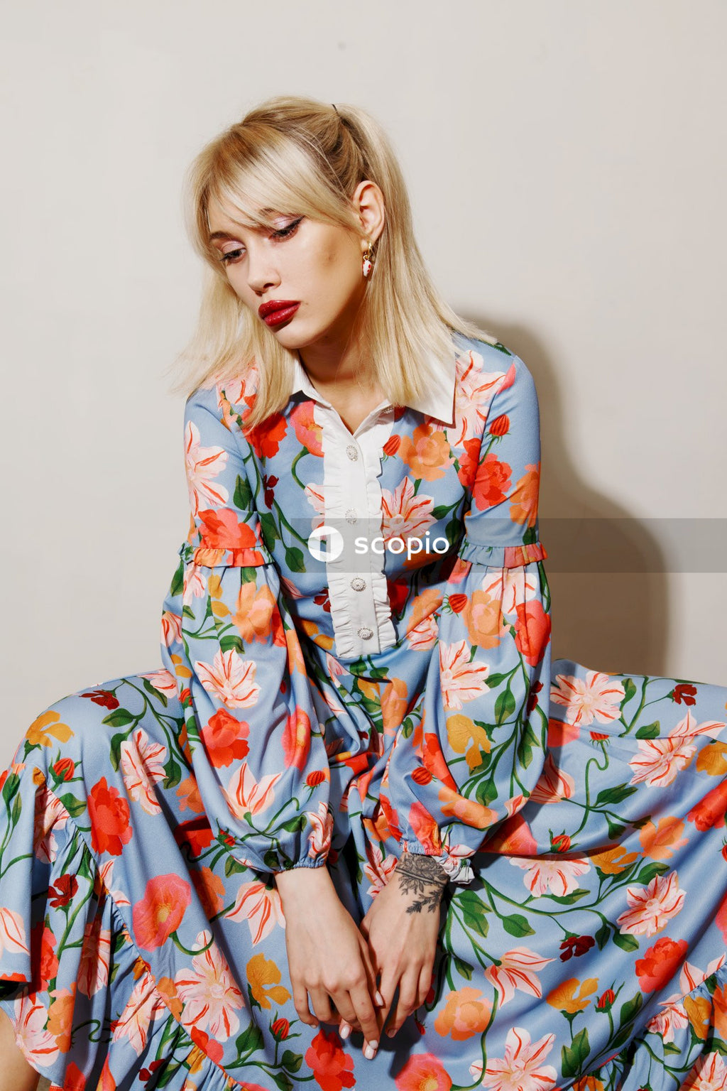 Woman in red and white floral robe