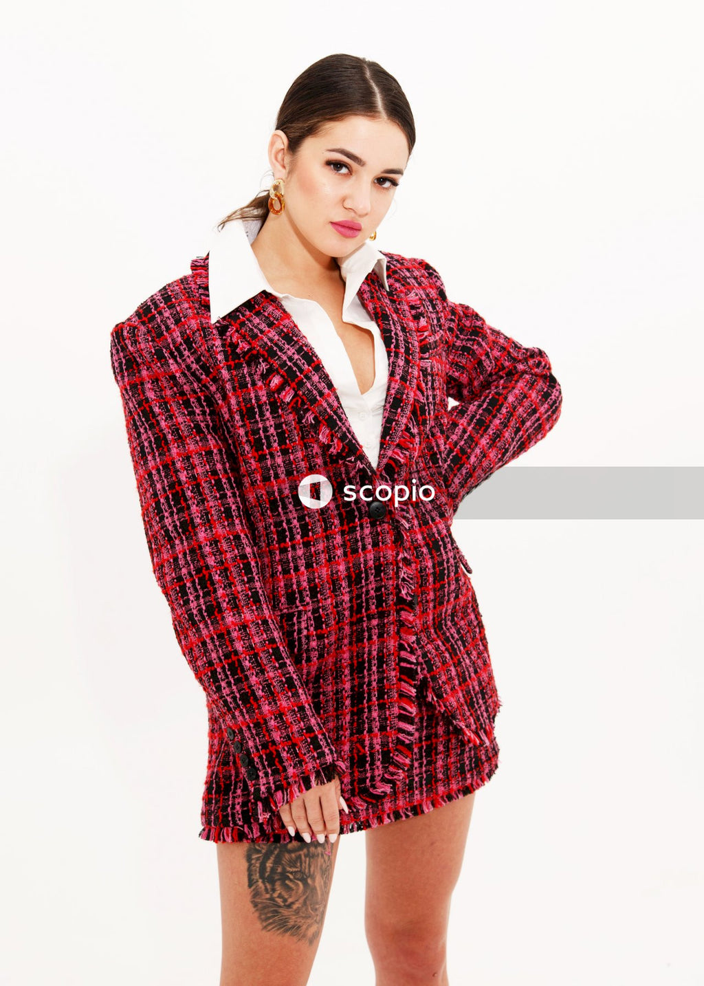 Woman in red and white plaid button up long sleeve shirt