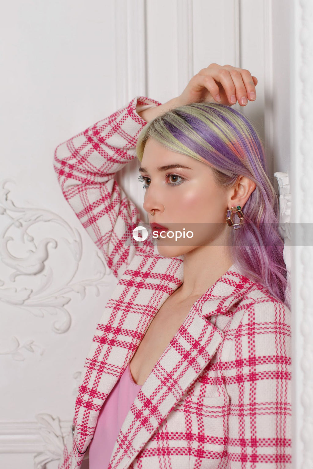 Woman in red and white plaid dress shirt