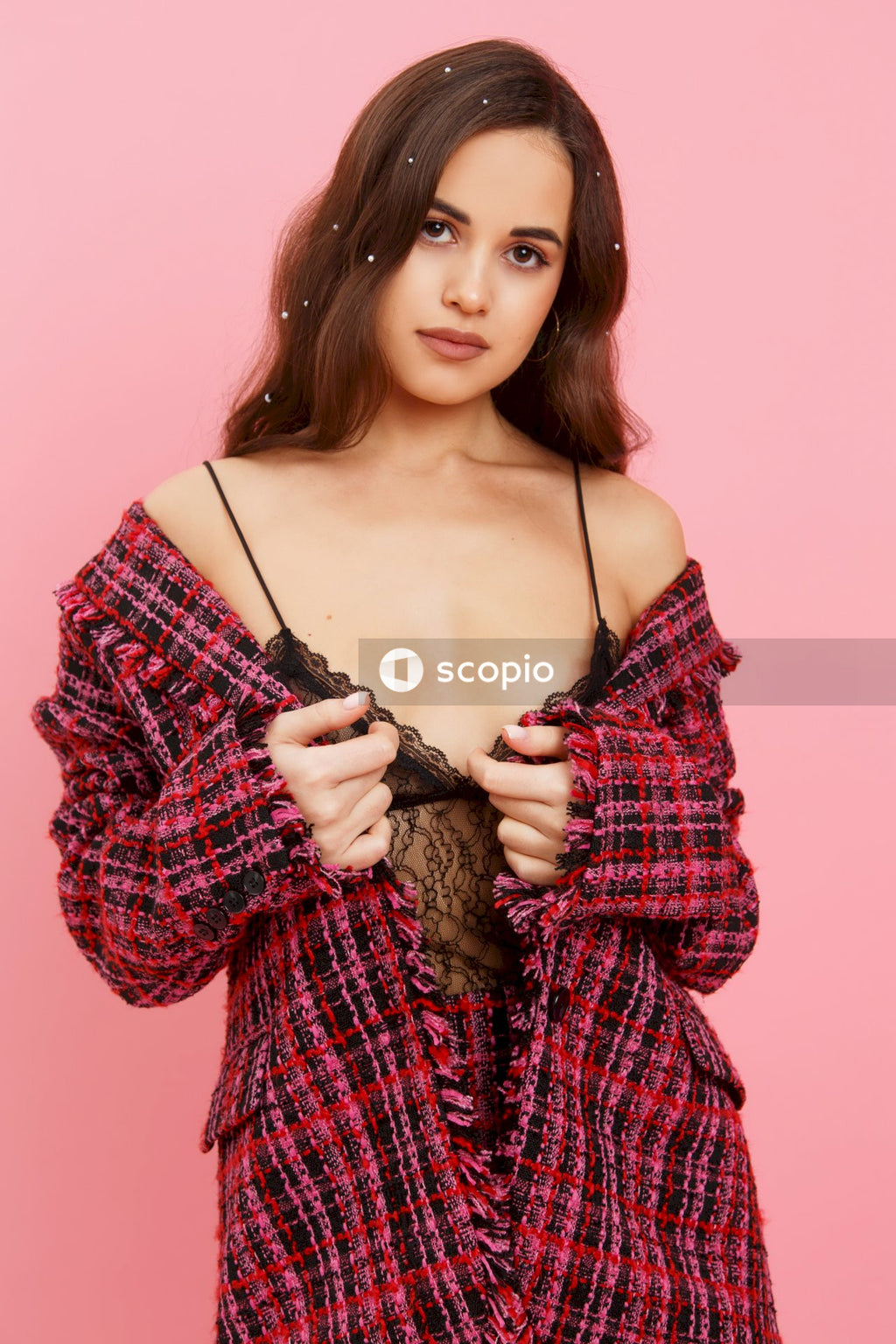 Woman in red and white plaid dress shirt