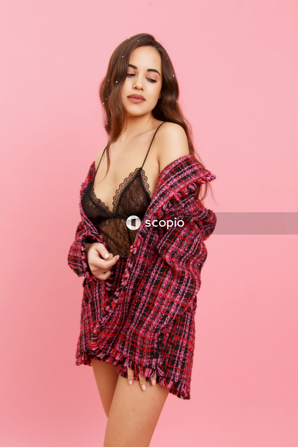 Woman in red and white plaid long sleeve shirt