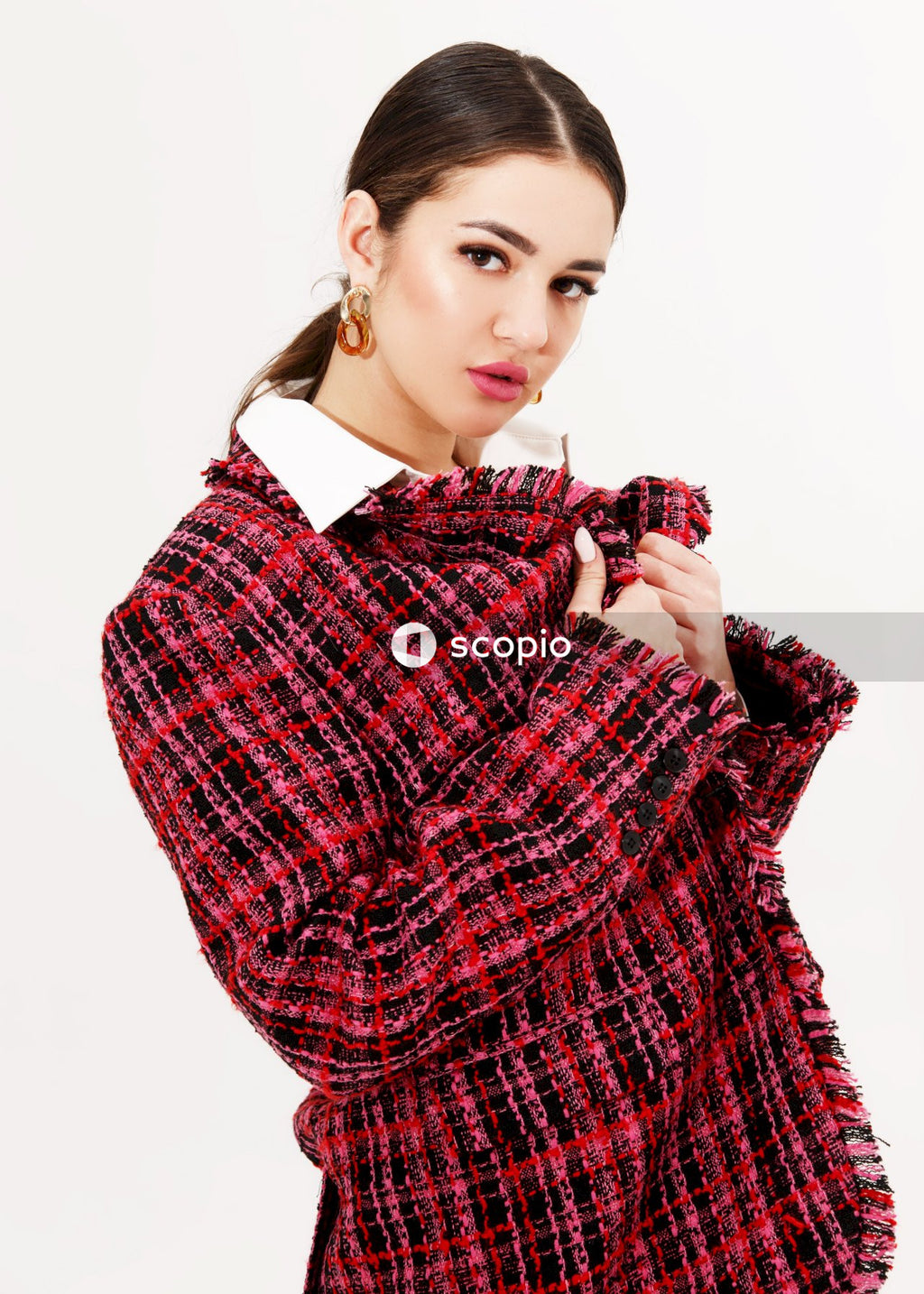 Woman in red black and white plaid dress shirt