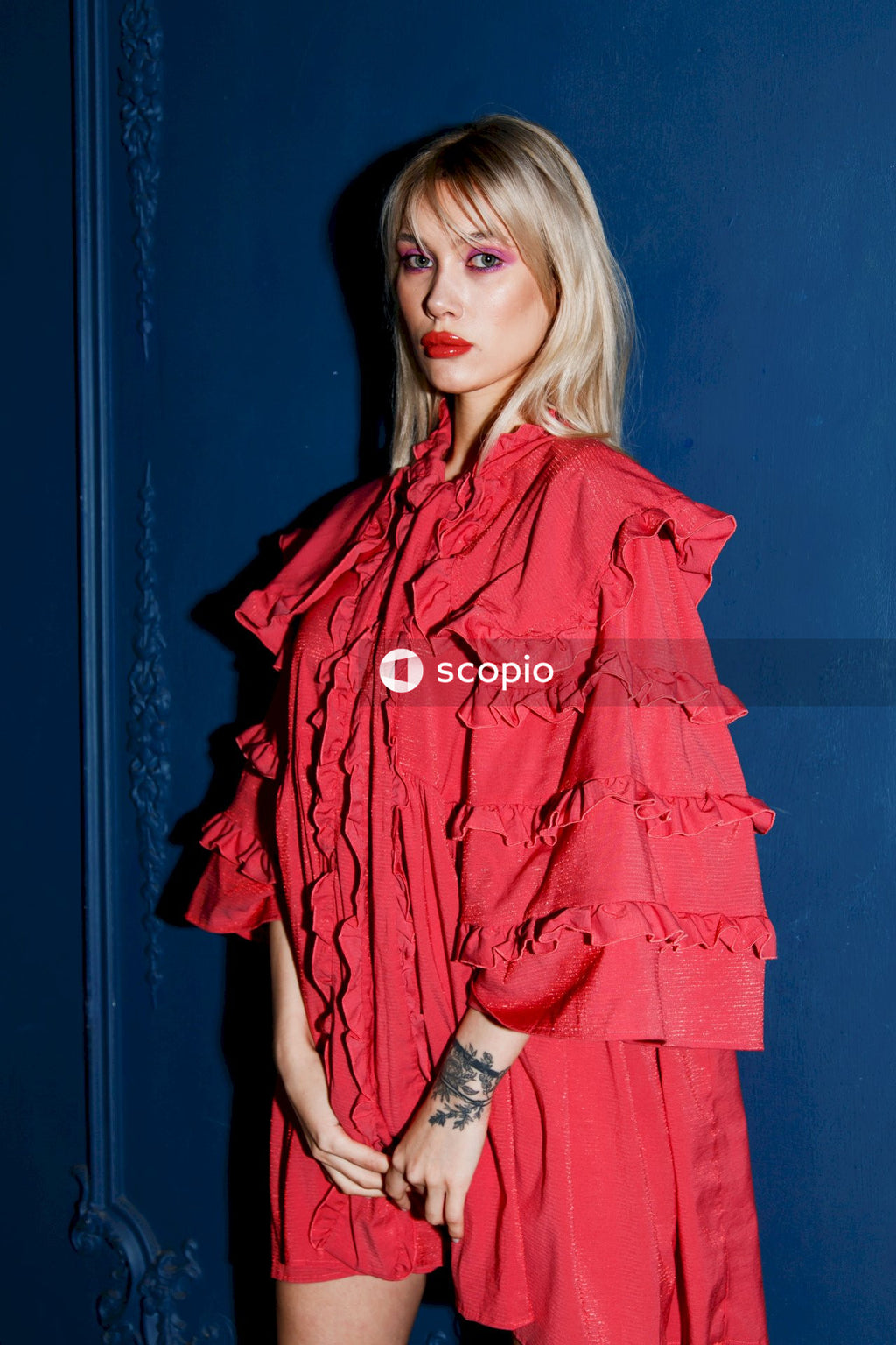 Woman in red dress standing