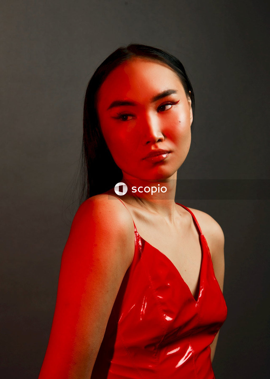 Woman in red spaghetti strap top