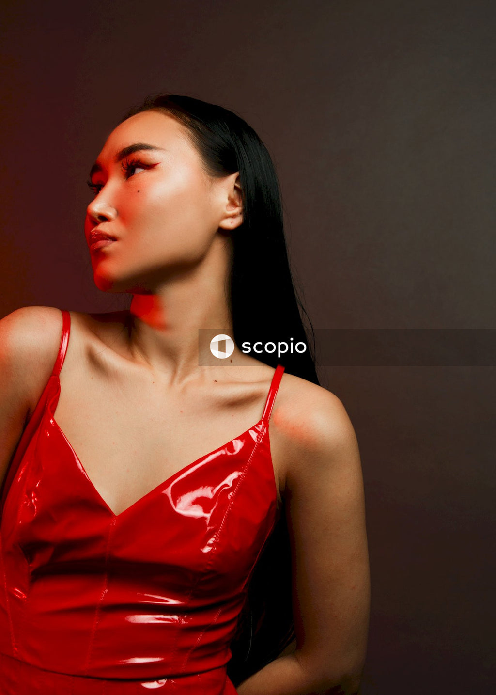 Woman in red spaghetti strap top
