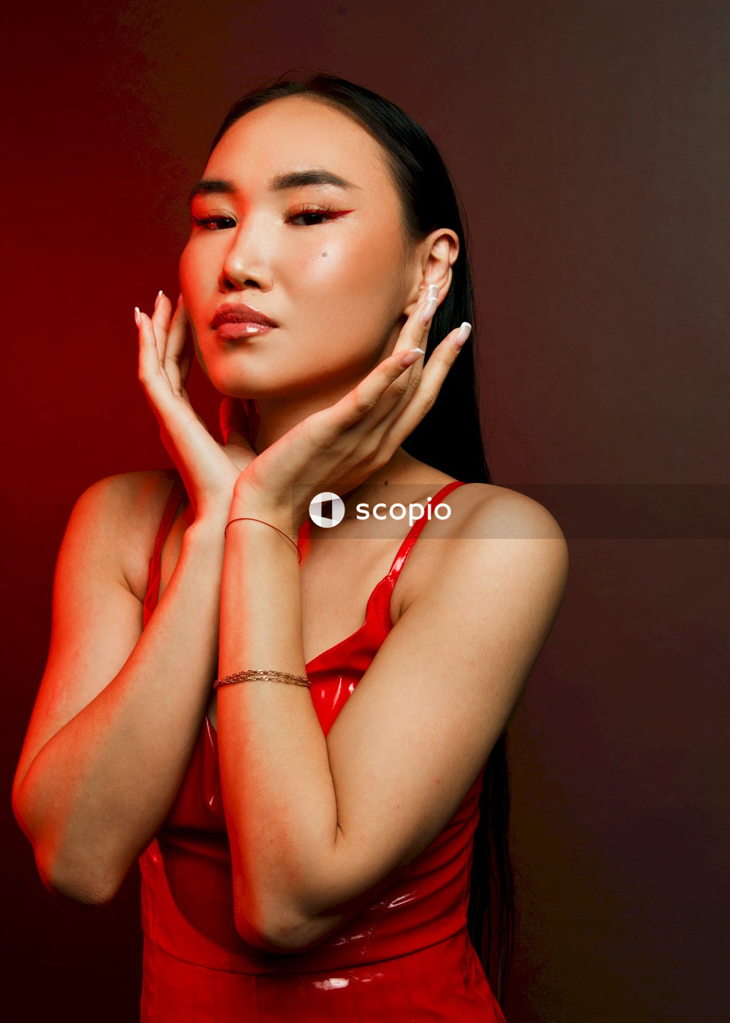 Woman in red spaghetti strap top