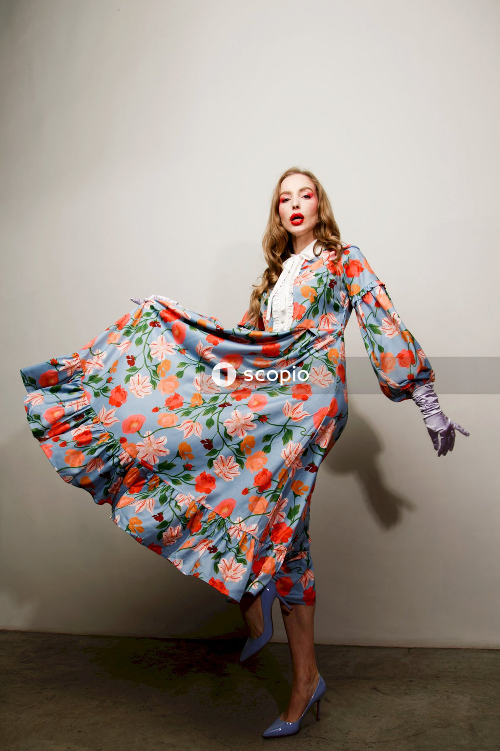 Woman in red white and blue floral long sleeve dress