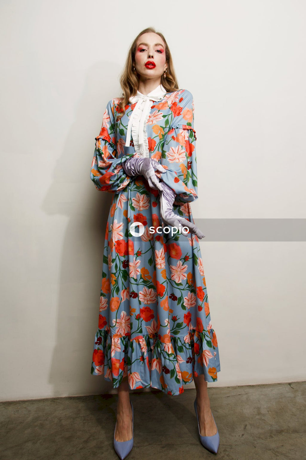 Woman in red white and blue floral long sleeve dress