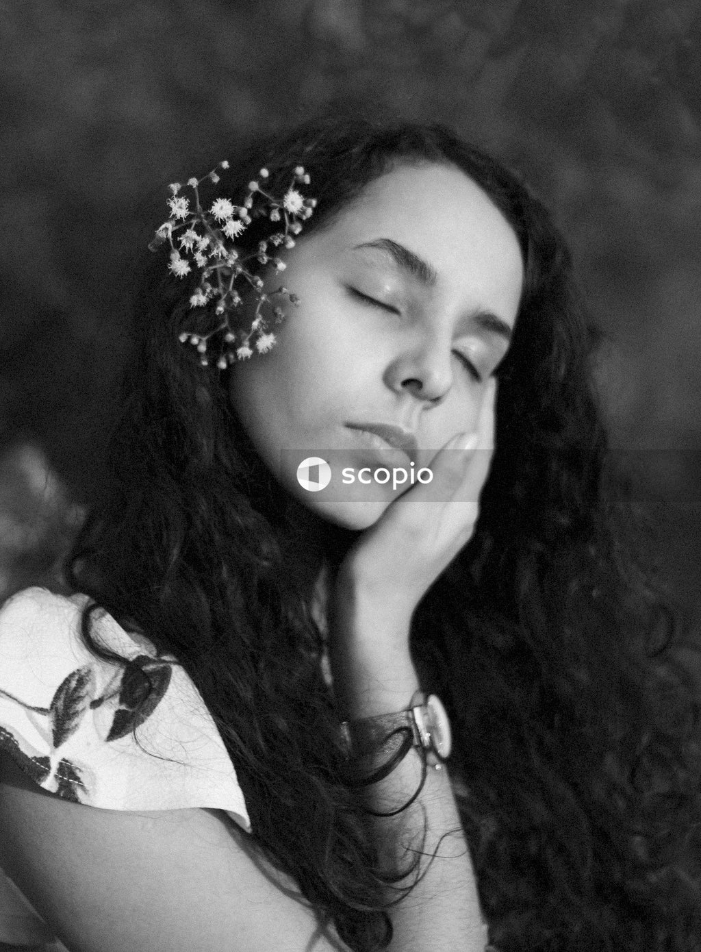 Woman in white and black floral shirt