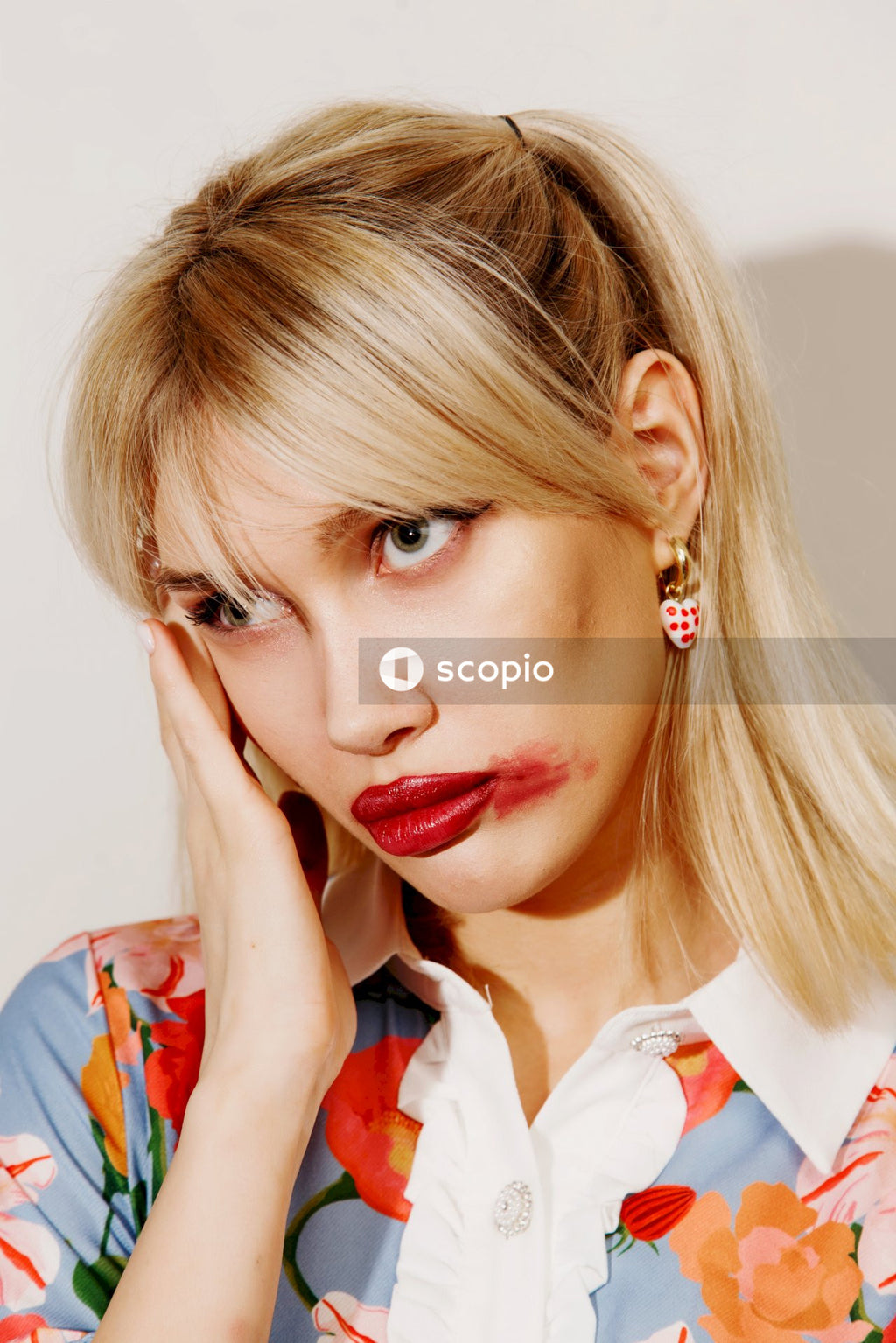 Woman in white and red collared shirt