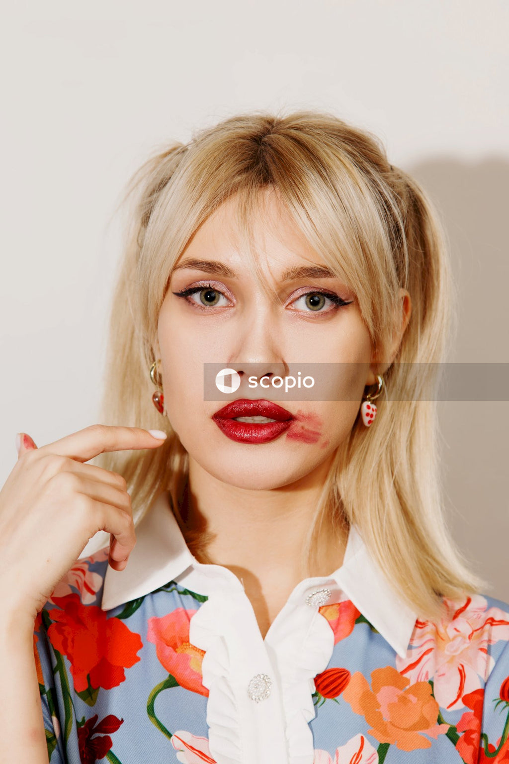Woman in white and red collared shirt