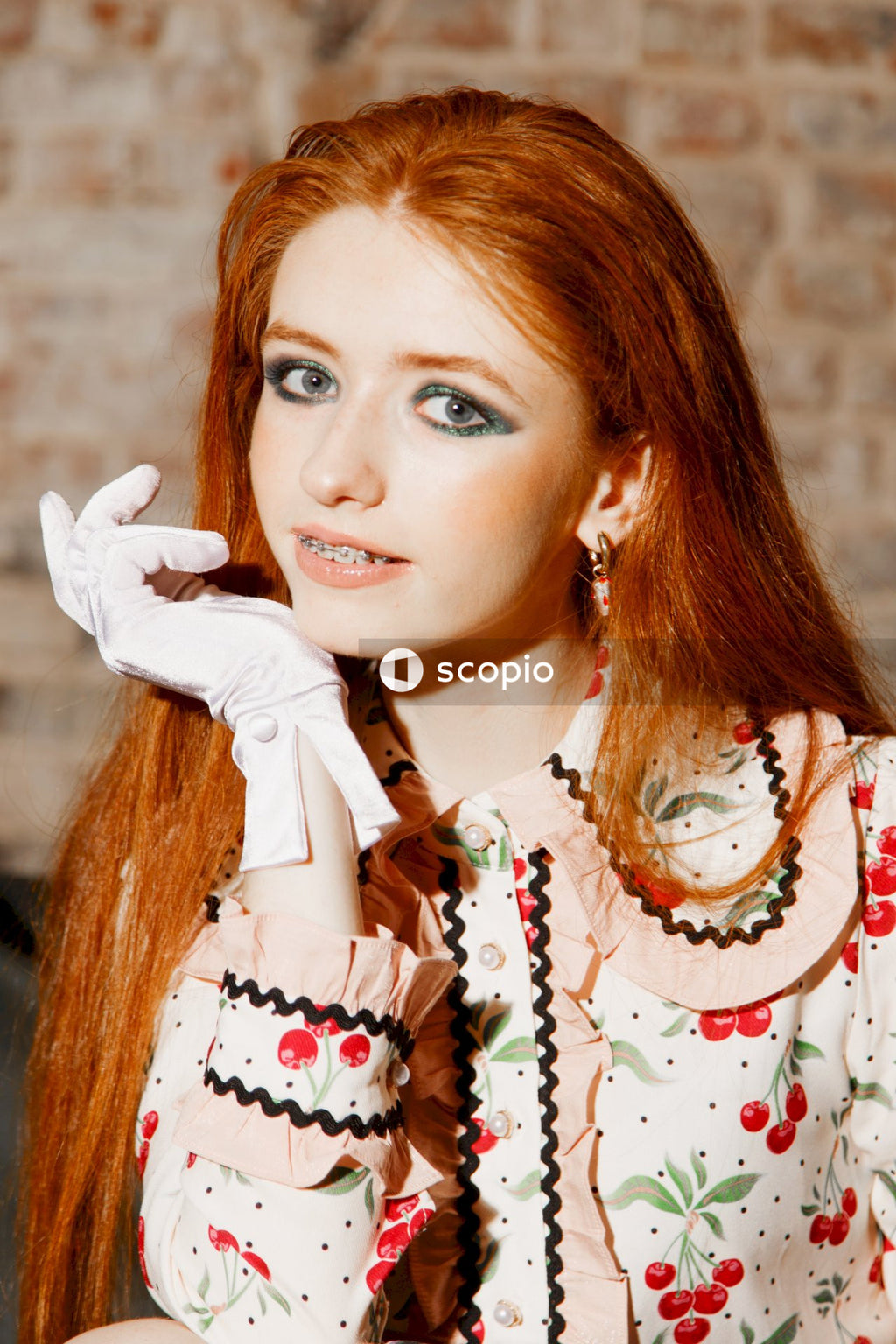 Woman in white and red floral dress