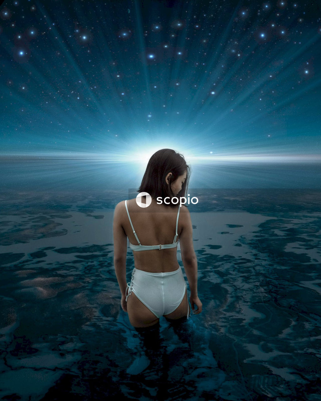Woman in white bikini standing on water standing on the earth