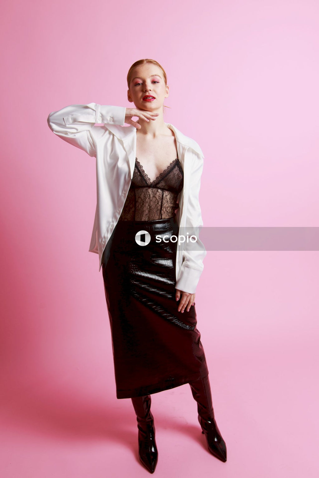 Woman in white blazer and black dress