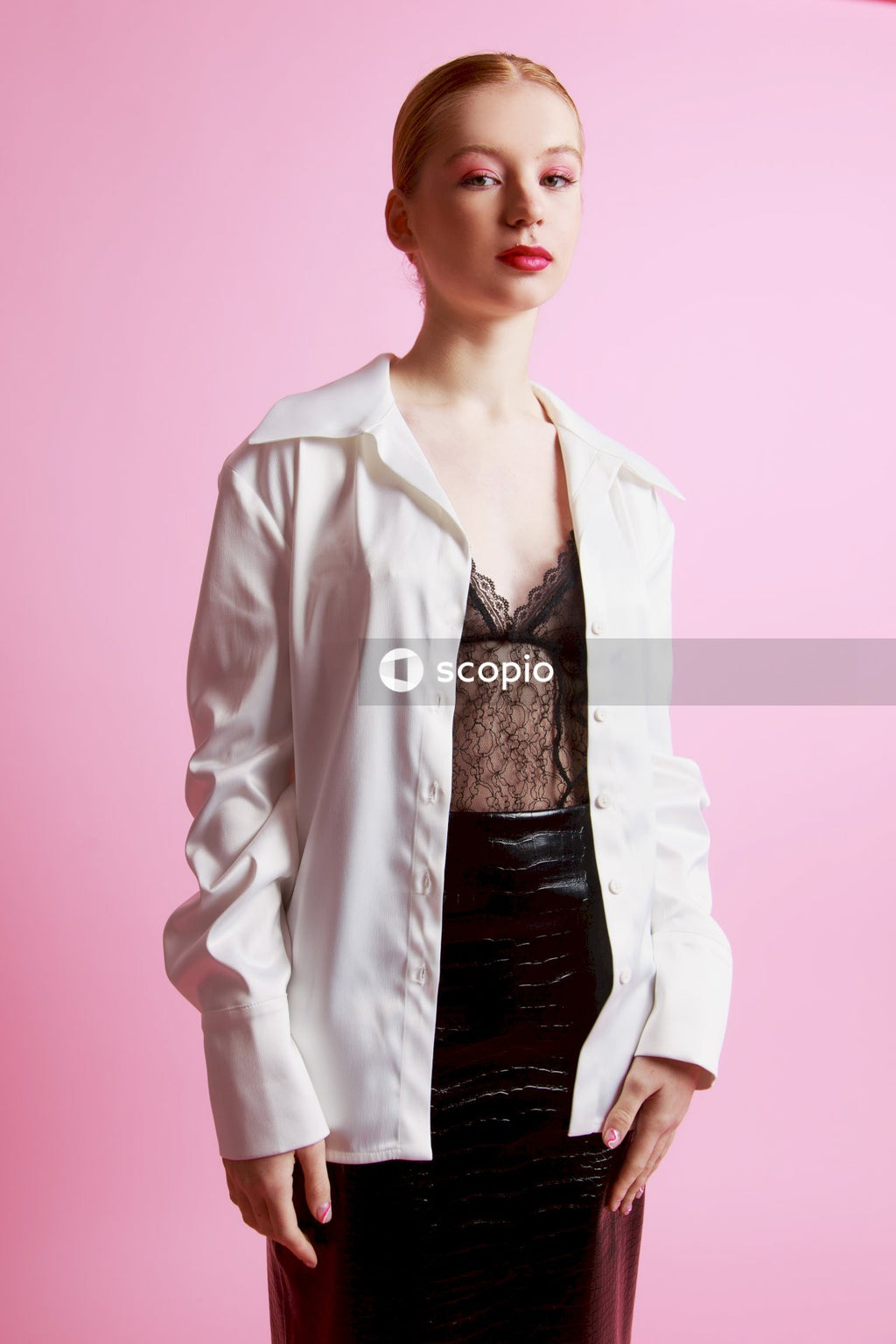 Woman in white blazer and black dress