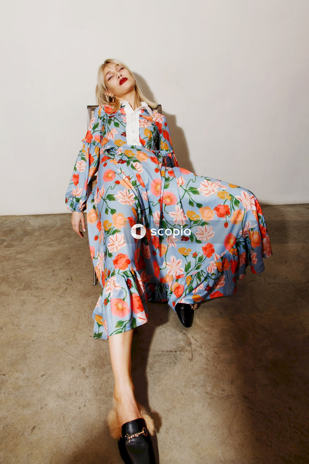 Woman in white blue and red floral dress