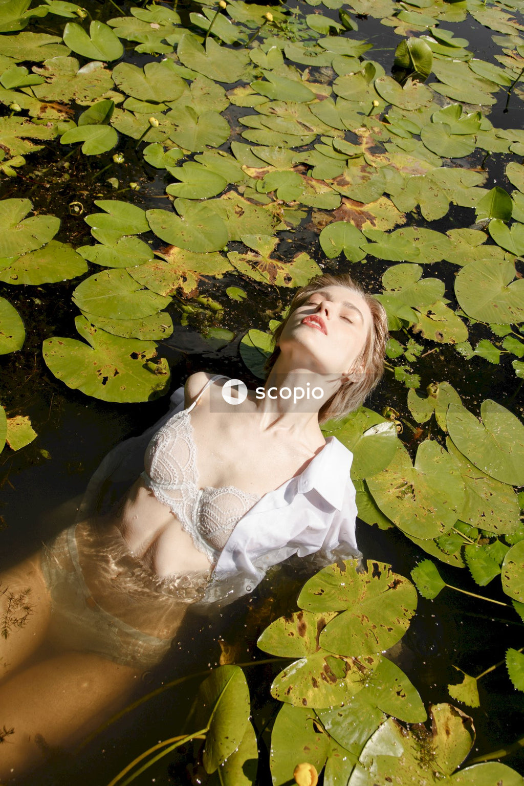 Woman in white brassiere on water
