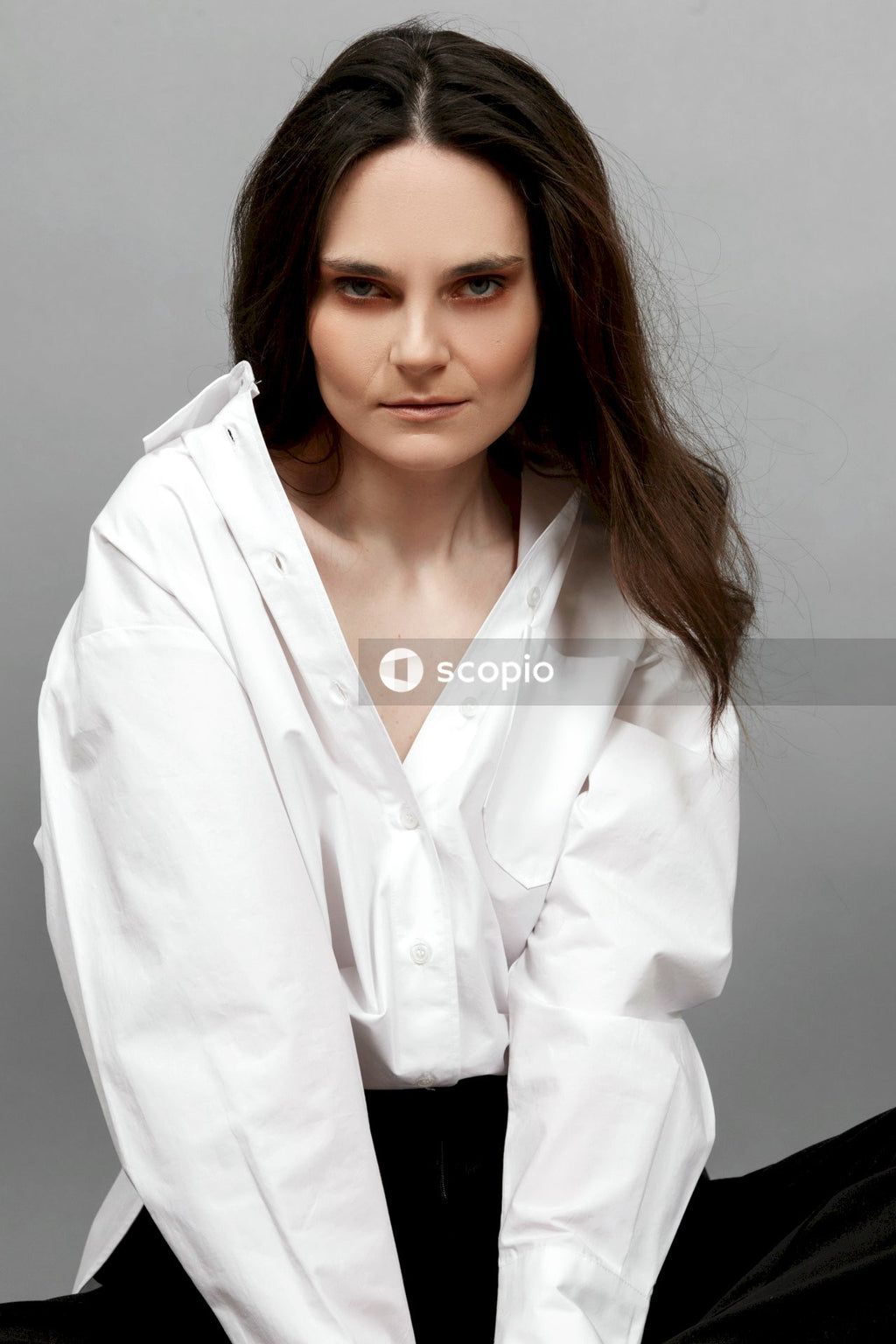 Woman in white button up long sleeve shirt